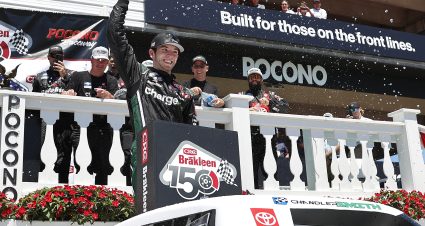 LONG POND, PENNSYLVANIA - JULY 23: Chandler Smith, driver of the #18 Charge Me Toyota, celebrates in victory lane after winning the NASCAR Camping World Truck Series CRC Brakleen 150 at Pocono Raceway on July 23, 2022 in Long Pond, Pennsylvania. (Photo by Tim Nwachukwu/Getty Images) | Getty Images