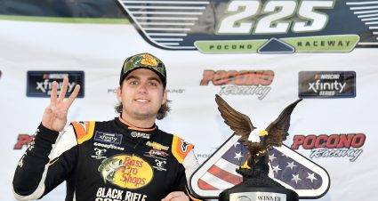 LONG POND, PENNSYLVANIA - JULY 23: Noah Gragson, driver of the #9 Bass Pro Shops/TrueTimber/BRCC Chevrolet, celebrates in victory lane after winning the NASCAR Xfinity Series Explore the Pocono Mountains 225 at Pocono Raceway on July 23, 2022 in Long Pond, Pennsylvania. (Photo by Logan Riely/Getty Images) | Getty Images