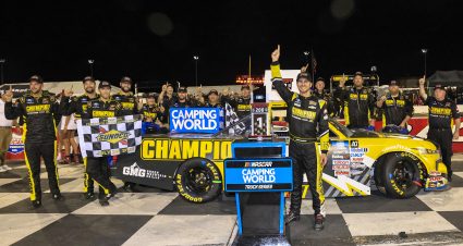 INDIANAPOLIS, INDIANA - JULY 29: Grant Enfinger, driver of the #23 Champion Power Equipment Chevrolet, celebrates in victory lane after winning the NASCAR Camping World Truck Series TSport 200 at Indianapolis Raceway Park on July 29, 2022 in Indianapolis, Indiana. (Photo by Justin Casterline/Getty Images)
