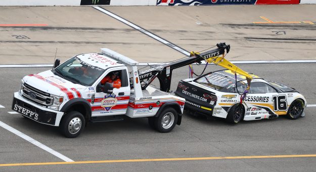 BROOKLYN, MICHIGAN - AUGUST 07: The #16 Chevy Accessories Chevrolet, driven by Noah Gragson is towed after an on-track incident during the NASCAR Cup Series FireKeepers Casino 400 at Michigan International Speedway on August 07, 2022 in Brooklyn, Michigan. (Photo by Mike Mulholland/Getty Images) | Getty Images