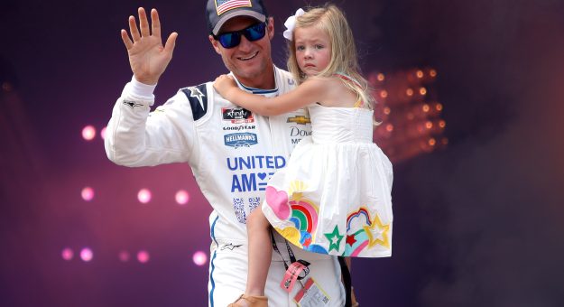 RICHMOND, VIRGINIA - SEPTEMBER 11: Dale Earnhardt Jr., driver of the #8 Unilever United For America Chevrolet, carries daughter, Isla Rose on stage during pre-race ceremonies prior to the NASCAR Xfinity Series Go Bowling 250 at Richmond Raceway on September 11, 2021 in Richmond, Virginia. (Photo by Sean Gardner/Getty Images) | Getty Images