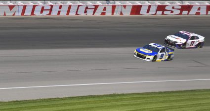 BROOKLYN, MICHIGAN - AUGUST 22: Chase Elliott, driver of the #9 NAPA Auto Parts Chevrolet, and Denny Hamlin, driver of the #11 FedEx Express Toyota, race during the NASCAR Cup Series FireKeepers Casino 400 at Michigan International Speedway on August 22, 2021 in Brooklyn, Michigan. (Photo by Logan Riely/Getty Images) | Getty Images