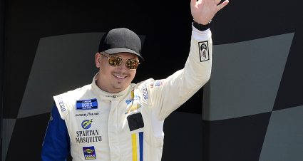 MADISON, ILLINOIS - JUNE 04: Brennan Poole, driver of the #46 G2G Racing Toyota, waves to fans onstage during driver intros prior to the NASCAR Camping World Truck Series Toyota 200 at WWT Raceway on June 04, 2022 in Madison, Illinois. (Photo by Jeff Curry/Getty Images) | Getty Images