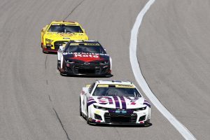 KANSAS CITY, KANSAS - SEPTEMBER 11: Alex Bowman, driver of the #48 Ally Chevrolet, Tyler Reddick, driver of the #8 Guaranteed Rate Chevrolet, and Joey Logano, driver of the #22 Shell Pennzoil Ford, race during the NASCAR Cup Series Hollywood Casino 400 at Kansas Speedway on September 11, 2022 in Kansas City, Kansas. (Photo by Meg Oliphant/Getty Images) | Getty Images