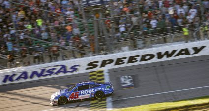 KANSAS CITY, KANSAS - SEPTEMBER 11: Bubba Wallace, driver of the #45 ROOT Insurance Toyota, crosses the finish line to win the NASCAR Cup Series Hollywood Casino 400 at Kansas Speedway on September 11, 2022 in Kansas City, Kansas. (Photo by Chris Graythen/Getty Images) | Getty Images
