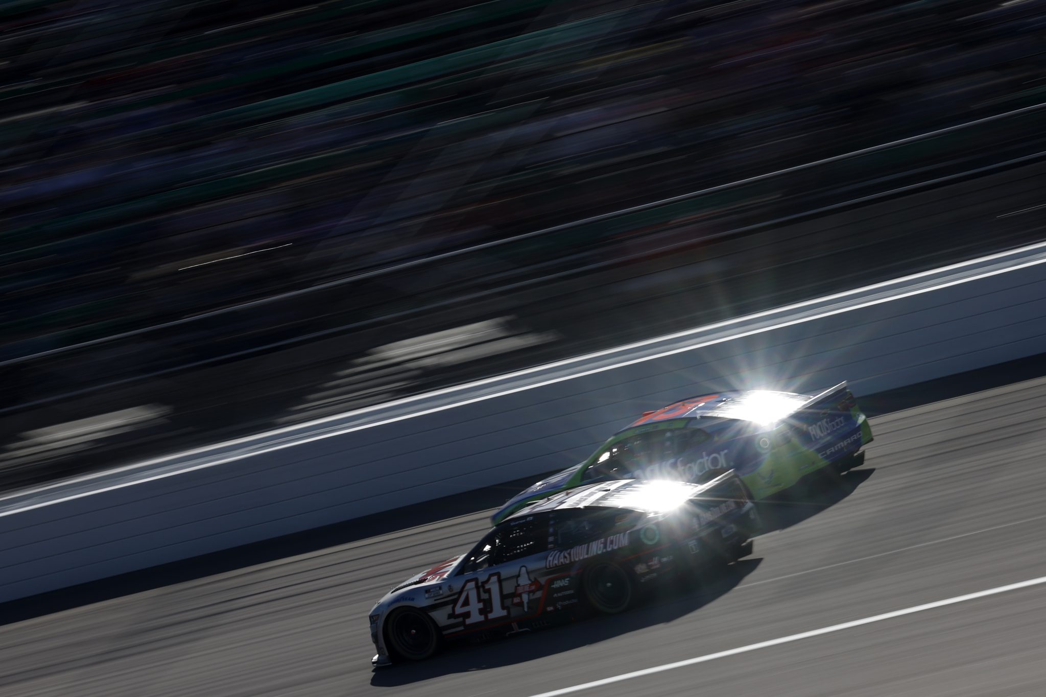 KANSAS CITY, KANSAS - SEPTEMBER 11: Cole Custer, driver of the #41 HaasTooling.com Ford, and Erik Jones, driver of the #43 FOCUSfactor.com Chevrolet, race during the NASCAR Cup Series Hollywood Casino 400 at Kansas Speedway on September 11, 2022 in Kansas City, Kansas. (Photo by Chris Graythen/Getty Images) | Getty Images