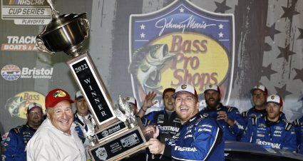 BRISTOL, TENNESSEE - SEPTEMBER 17: Chris Buescher, driver of the #17 Fastenal Ford, is presented the Bristol Motor Speedway trophy by Johnny Morris, founder and CEO of Bass Pro Shops in victory lane after winning the NASCAR Cup Series Bass Pro Shops Night Race at Bristol Motor Speedway on September 17, 2022 in Bristol, Tennessee. (Photo by Sean Gardner/Getty Images) | Getty Images