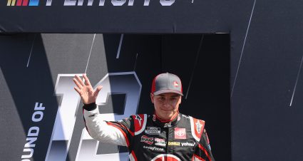 FORT WORTH, TEXAS - SEPTEMBER 25: Christopher Bell, driver of the #20 Rheem - Smurfit Kappa Toyota, waves to fans walks onstage during driver intros prior to the NASCAR Cup Series Auto Trader EchoPark Automotive 500 at Texas Motor Speedway on September 25, 2022 in Fort Worth, Texas. (Photo by James Gilbert/Getty Images) | Getty Images