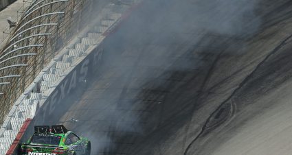 FORT WORTH, TEXAS - SEPTEMBER 25: Kyle Busch, driver of the #18 Interstate Batteries Toyota, spins into the wall after an on-track incident during the NASCAR Cup Series Auto Trader EchoPark Automotive 500 at Texas Motor Speedway on September 25, 2022 in Fort Worth, Texas. (Photo by James Gilbert/Getty Images) | Getty Images