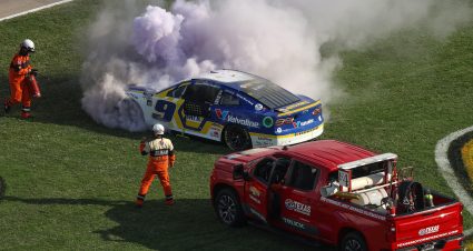 FORT WORTH, TEXAS - SEPTEMBER 25: The NASCAR Safety Crew assist Chase Elliott, driver of the #9 NAPA Auto Parts Chevrolet, after an on-track incident during the NASCAR Cup Series Auto Trader EchoPark Automotive 500 at Texas Motor Speedway on September 25, 2022 in Fort Worth, Texas. (Photo by James Gilbert/Getty Images) | Getty Images