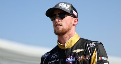 FORT WORTH, TEXAS - SEPTEMBER 24: Brandon Brown, driver of the #68 CAT Trailer Sales Chevrolet, walks the grid during practice for the NASCAR Xfinity Series Andy's Frozen Custard 300 at Texas Motor Speedway on September 24, 2022 in Fort Worth, Texas. (Photo by James Gilbert/Getty Images) | Getty Images
