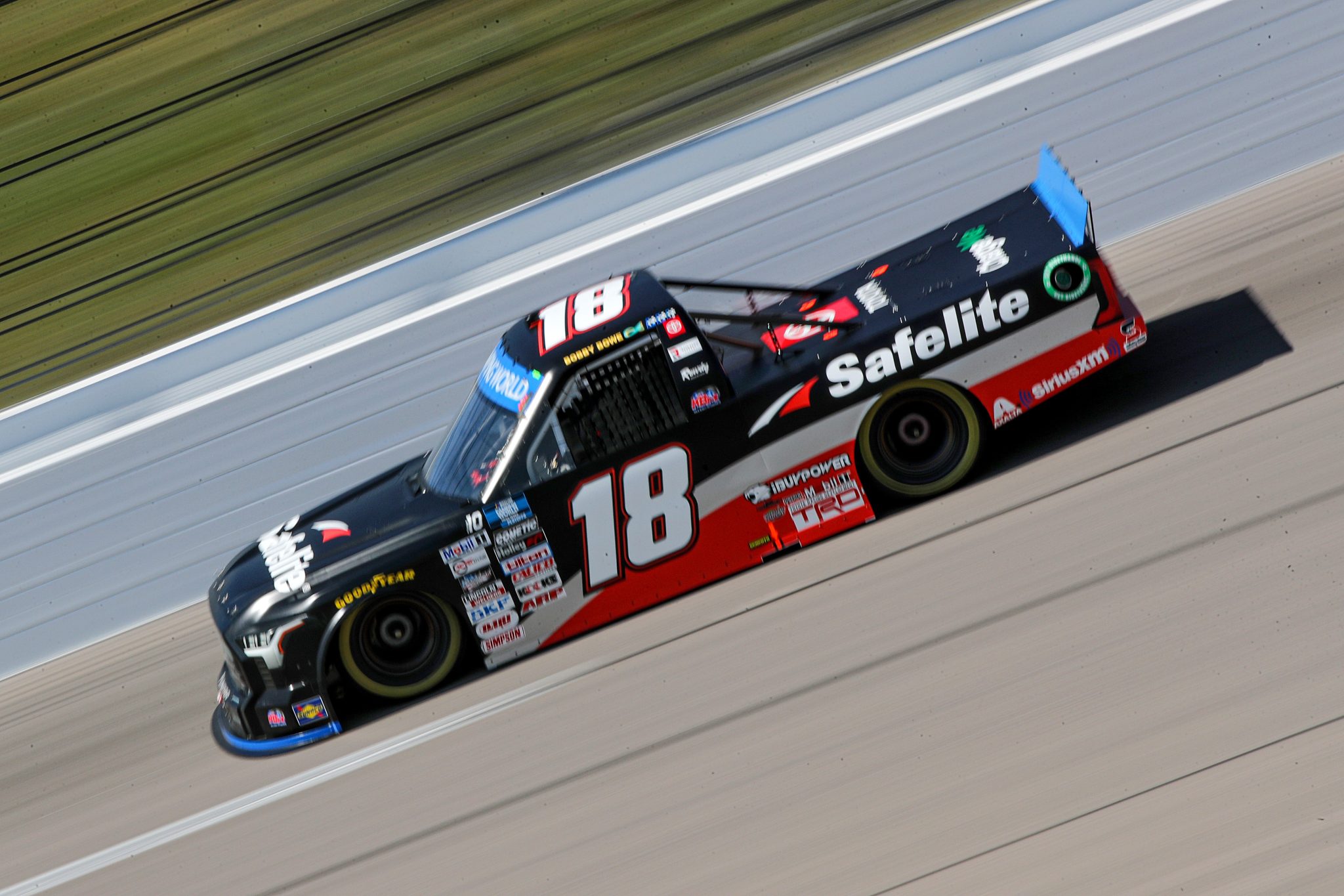 KANSAS CITY, KANSAS - SEPTEMBER 09: Chandler Smith, driver of the #18 Safelite AutoGlass Toyota, drives during practice for the NASCAR Camping World Truck Series Kansas Lottery 200 at Kansas Speedway on September 09, 2022 in Kansas City, Kansas. (Photo by Meg Oliphant/Getty Images) | Getty Images