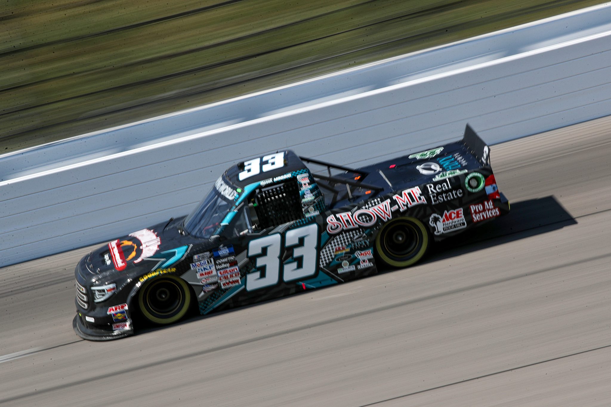 KANSAS CITY, KANSAS - SEPTEMBER 09: Mason Maggio, driver of the #33 Professional Ag Services Toyota, drives during qualifying for the NASCAR Camping World Truck Series Kansas Lottery 200 at Kansas Speedway on September 09, 2022 in Kansas City, Kansas. (Photo by Meg Oliphant/Getty Images) | Getty Images