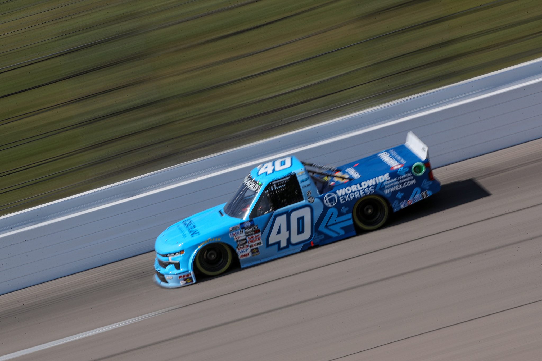 KANSAS CITY, KANSAS - SEPTEMBER 09: Dean Thompson, driver of the #40 Worldwide Express Chevrolet, drives during qualifying for the NASCAR Camping World Truck Series Kansas Lottery 200 at Kansas Speedway on September 09, 2022 in Kansas City, Kansas. (Photo by Meg Oliphant/Getty Images) | Getty Images