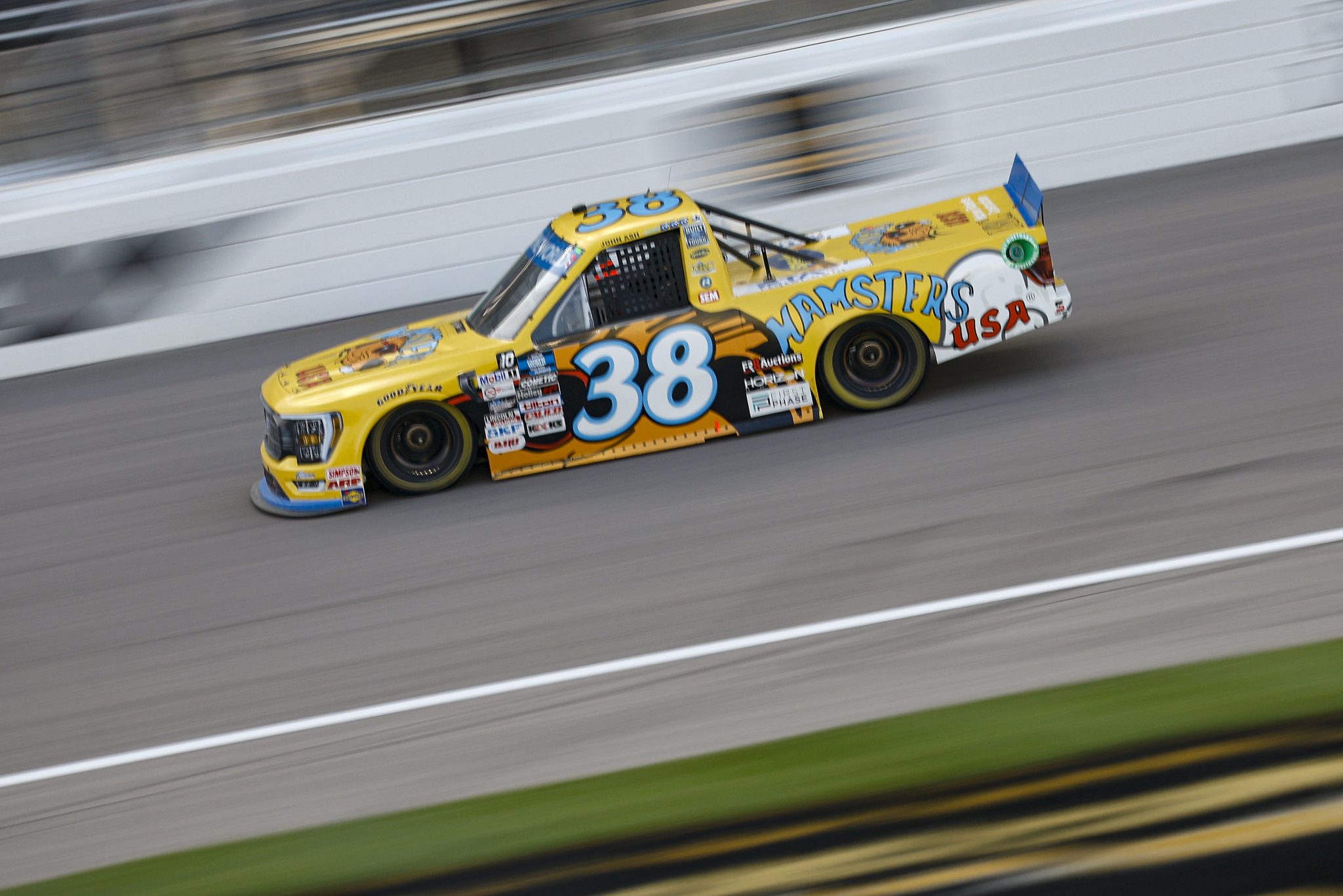 KANSAS CITY, KANSAS - SEPTEMBER 09: Zane Smith, driver of the #38 Hamsters USA Ford, drives during the NASCAR Camping World Truck Series Kansas Lottery 200 at Kansas Speedway on September 09, 2022 in Kansas City, Kansas. (Photo by Chris Graythen/Getty Images) | Getty Images