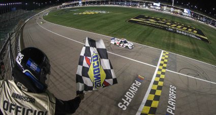 KANSAS CITY, KANSAS - SEPTEMBER 09: John Hunter Nemechek, driver of the #4 Mobil 1 Toyota, takes the checkered flag to win the NASCAR Camping World Truck Series Kansas Lottery 200 at Kansas Speedway on September 09, 2022 in Kansas City, Kansas. (Photo by Meg Oliphant/Getty Images) | Getty Images