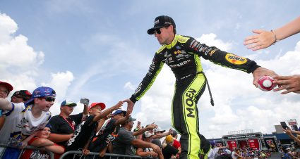 BROOKLYN, MICHIGAN - AUGUST 07: Ryan Blaney, driver of the #12 Menards/Cardell Caninetry Ford, greets fans during driver intros prior to the NASCAR Cup Series FireKeepers Casino 400 at Michigan International Speedway on August 07, 2022 in Brooklyn, Michigan. (Photo by Sean Gardner/Getty Images) | Getty Images