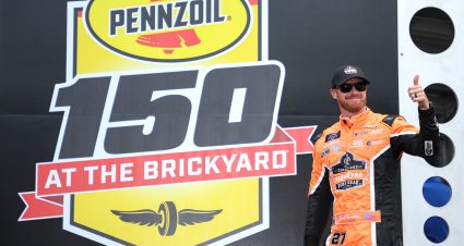 INDIANAPOLIS, INDIANA - JULY 30: Jeb Burton, driver of the #27 Ergodyne Work Gear Chevrolet, gives a thumbs up to fans as he walks onstage during driver intros prior to the NASCAR Xfinity Series Pennzoil 150 at the Brickyard at Indianapolis Motor Speedway on July 30, 2022 in Indianapolis, Indiana. (Photo by James Gilbert/Getty Images) | Getty Images