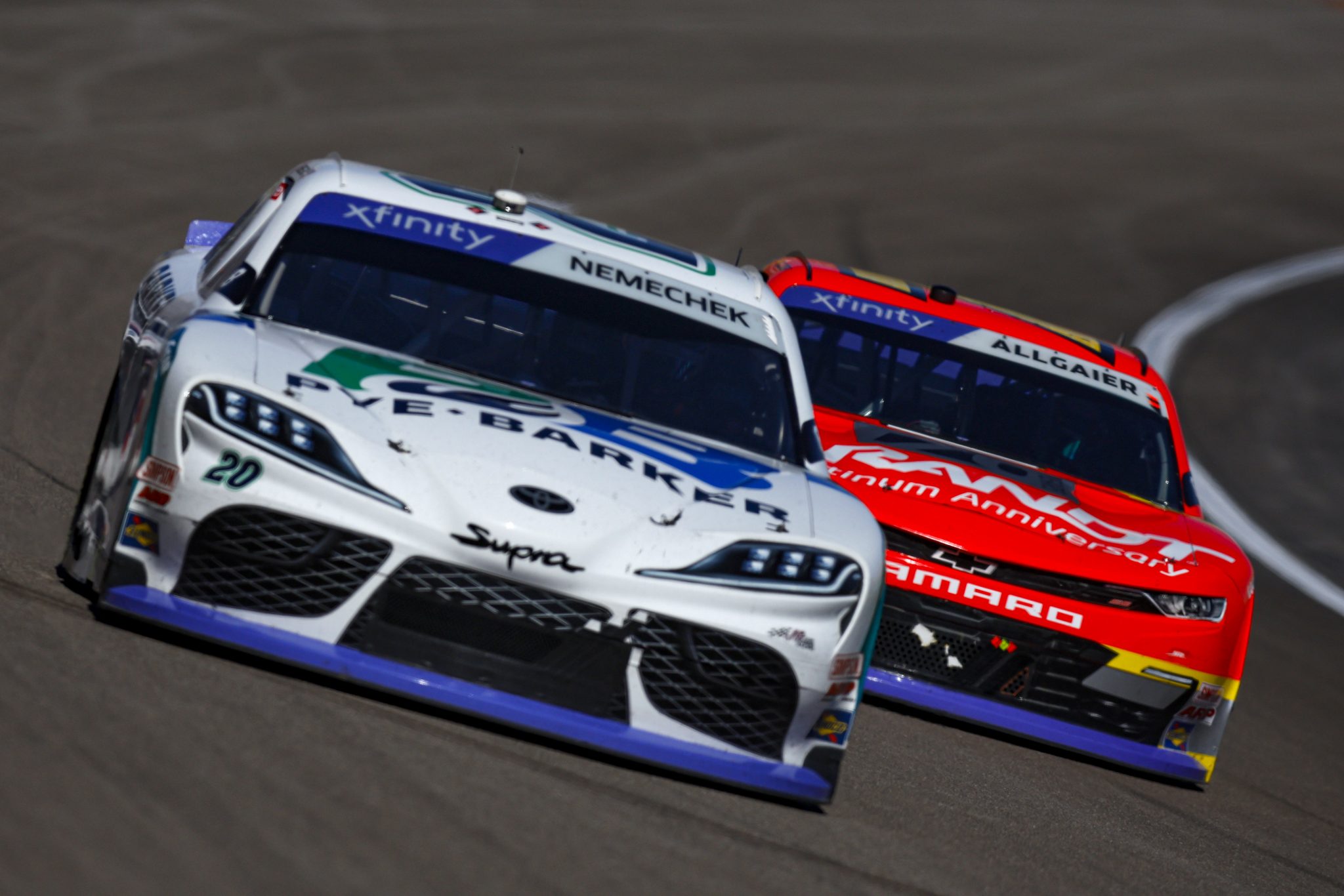 LAS VEGAS, NEVADA - OCTOBER 14: John Hunter Nemechek, driver of the #20 Pye Barker Fire & Safety Toyota, and Justin Allgaier, driver of the #7 BRANDT Chevrolet, race during the NASCAR Xfinity Series Alsco Uniforms 302 at Las Vegas Motor Speedway on October 14, 2023 in Las Vegas, Nevada. (Photo by Sean Gardner/Getty Images) | Getty Images