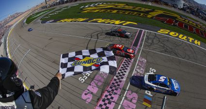 LAS VEGAS, NEVADA - OCTOBER 15: Kyle Larson, driver of the #5 HendrickCars.com Chevrolet, takes the checkered flag over Christopher Bell, driver of the #20 Rheem/Smurfit Kappa Toyota, to win the NASCAR Cup Series South Point 400 at Las Vegas Motor Speedway on October 15, 2023 in Las Vegas, Nevada. (Photo by Sean Gardner/Getty Images) | Getty Images