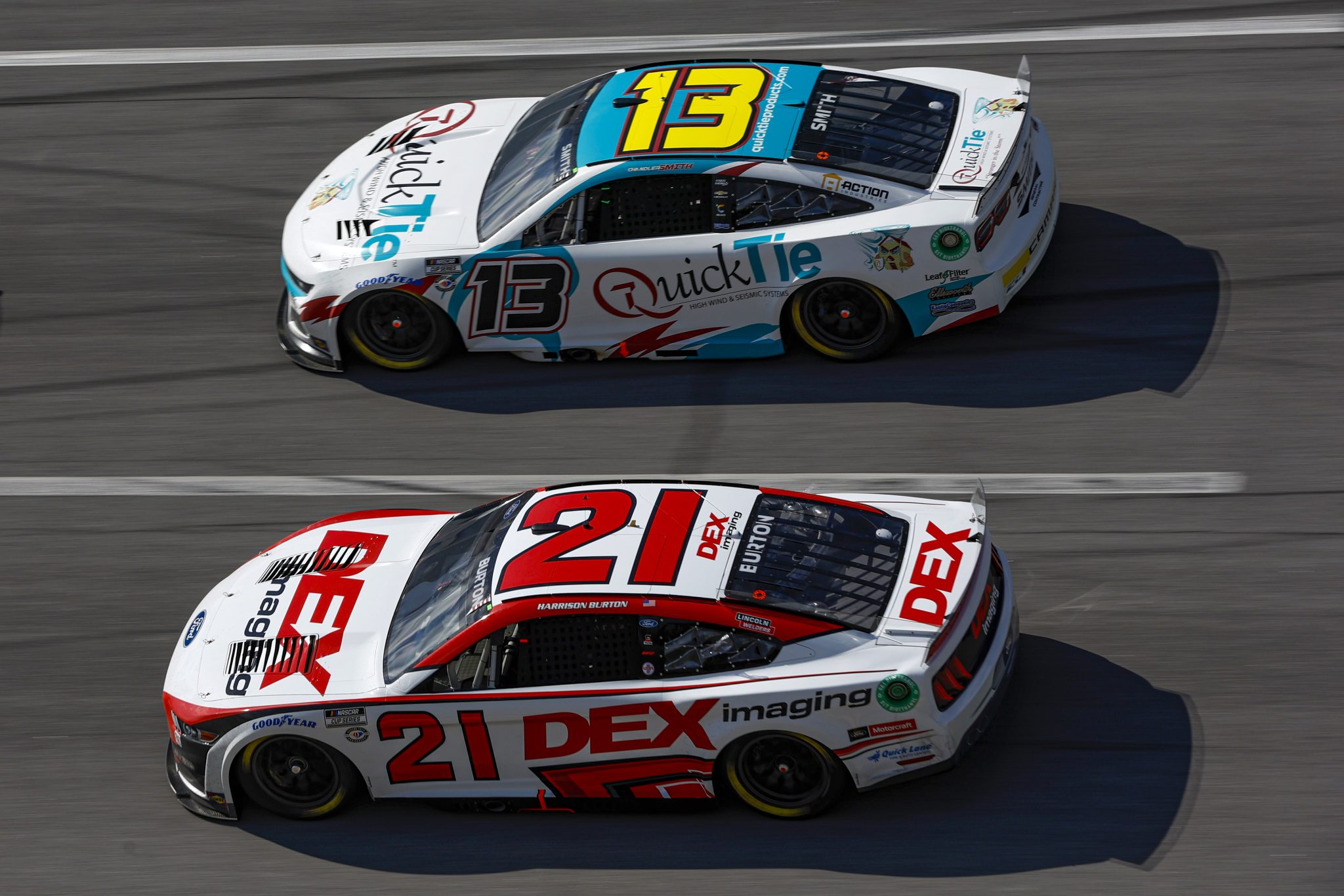 TALLADEGA, ALABAMA - OCTOBER 01: Chandler Smith, driver of the #13 Quick Tie Products Inc. Chevrolet, and Harrison Burton, driver of the #21 DEX Imaging Ford, race during the NASCAR Cup Series YellaWood 500 at Talladega Superspeedway on October 01, 2023 in Talladega, Alabama. (Photo by Sean Gardner/Getty Images) | Getty Images