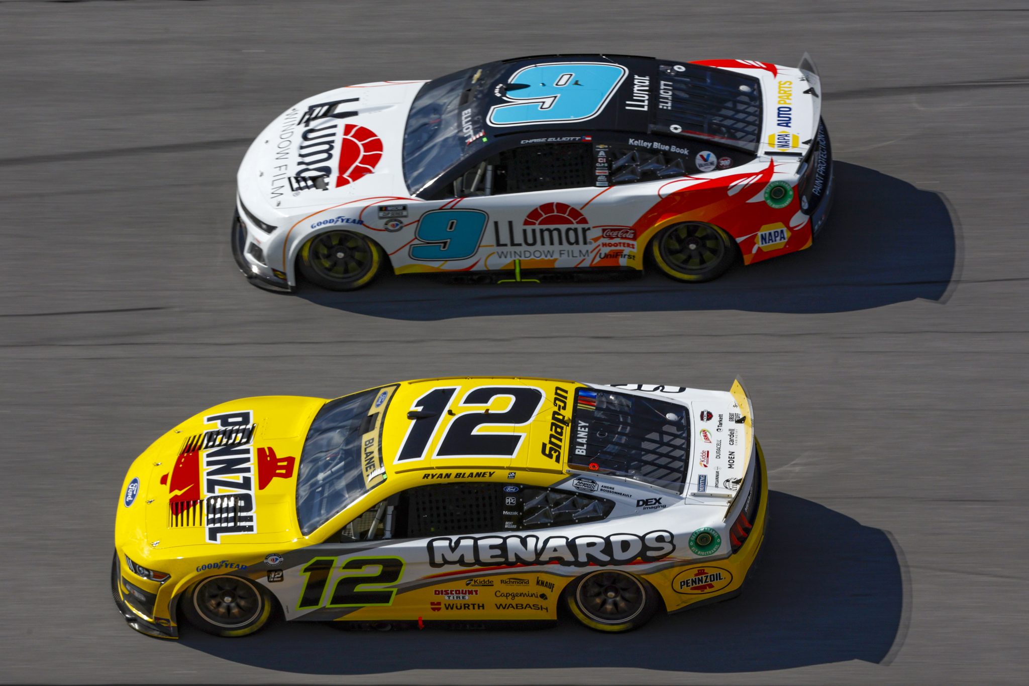TALLADEGA, ALABAMA - OCTOBER 01: Ryan Blaney, driver of the #12 Menards/Pennzoil Ford, and Chase Elliott, driver of the #9 LLumar Chevrolet, race during the NASCAR Cup Series YellaWood 500 at Talladega Superspeedway on October 01, 2023 in Talladega, Alabama. (Photo by Sean Gardner/Getty Images) | Getty Images