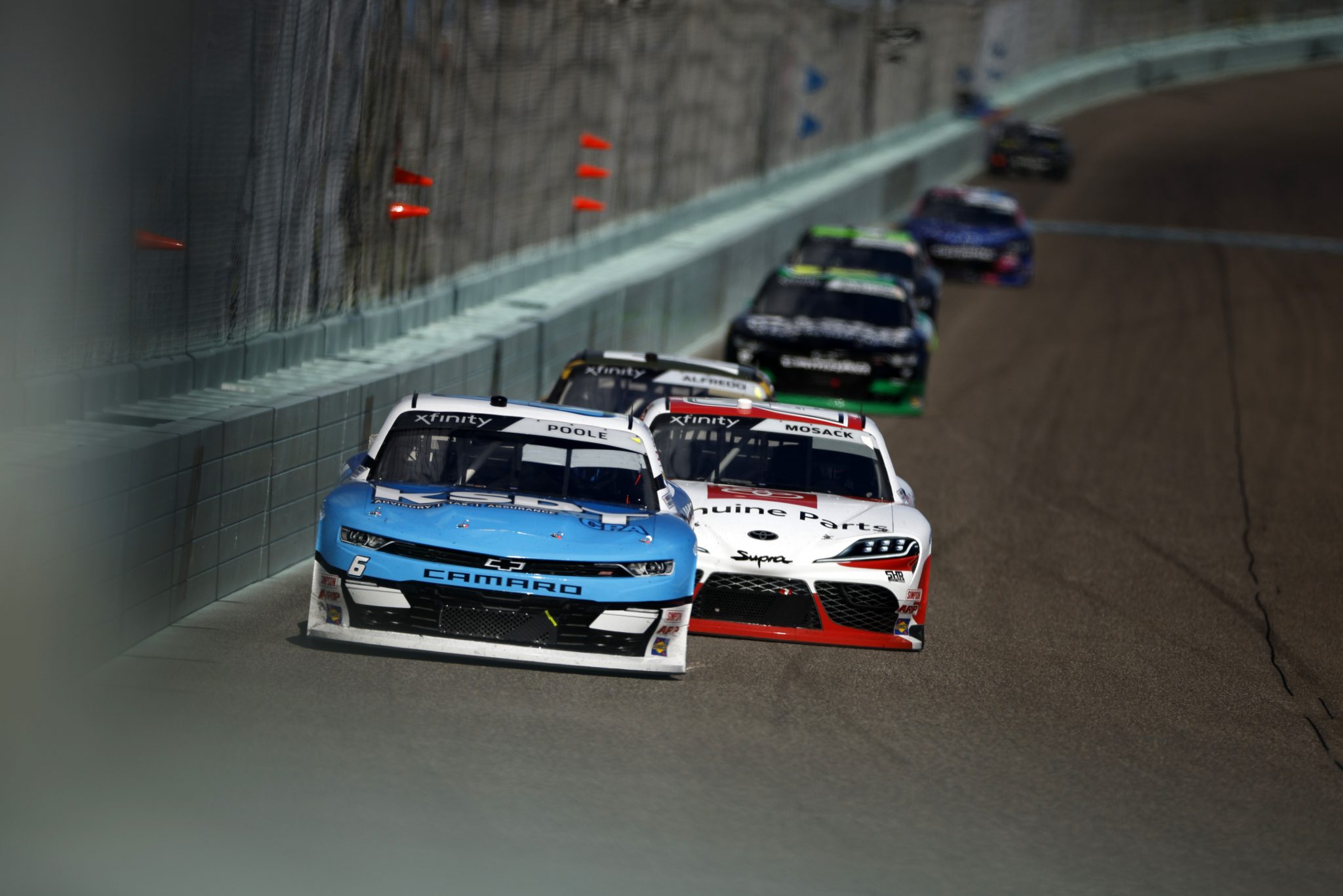 HOMESTEAD, FLORIDA - OCTOBER 21: Brennan Poole, driver of the #6 KSDT CPA Chevrolet, and Connor Mosack, driver of the #24 Toyota Genuine Parts Toyota, race during the NASCAR Xfinity Series Contender Boats 300 at Homestead-Miami Speedway on October 21, 2023 in Homestead, Florida. (Photo by James Gilbert/Getty Images) | Getty Images