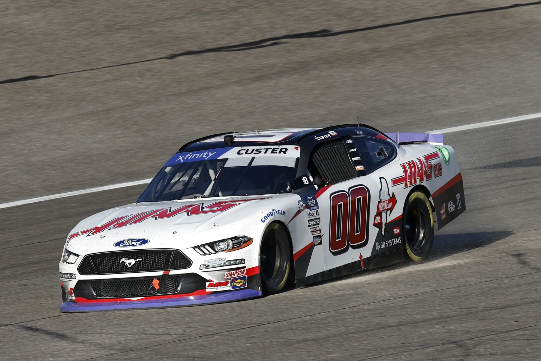 HOMESTEAD, FLORIDA - OCTOBER 21: Cole Custer, driver of the #00 Haas Automation Ford, blows out the right front tire during the NASCAR Xfinity Series Contender Boats 300 at Homestead-Miami Speedway on October 21, 2023 in Homestead, Florida. (Photo by Sean Gardner/Getty Images) | Getty Images