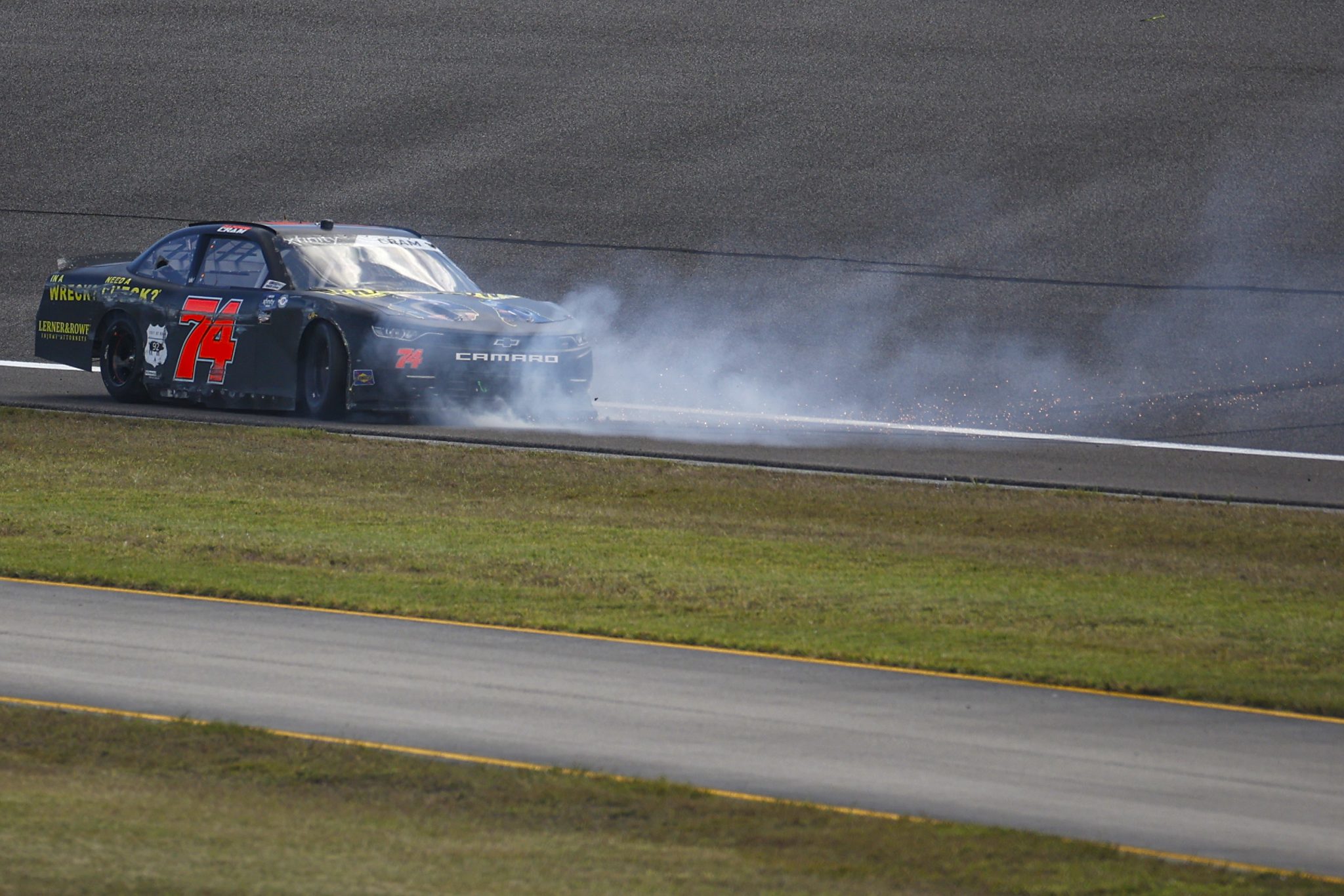 HOMESTEAD, FLORIDA - OCTOBER 21: Dawson Cram, driver of the #74 Lerner & Rowe Injury Lawyers Chevrolet, spins after an on-track incident during the NASCAR Xfinity Series Contender Boats 300 at Homestead-Miami Speedway on October 21, 2023 in Homestead, Florida. (Photo by James Gilbert/Getty Images) | Getty Images