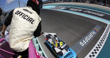 HOMESTEAD, FLORIDA - OCTOBER 21: Carson Hocevar, driver of the #42 Worldwide Express Chevrolet, takes the checkered flag to win the NASCAR Craftsman Truck Series Baptist Health Cancer Care 200 at Homestead-Miami Speedway on October 21, 2023 in Homestead, Florida. (Photo by James Gilbert/Getty Images) | Getty Images