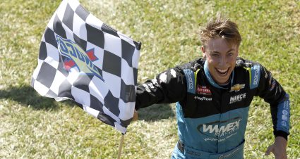 HOMESTEAD, FLORIDA - OCTOBER 21: Carson Hocevar, driver of the #42 Worldwide Express Chevrolet, celebrates with the checkered flag after winning the NASCAR Craftsman Truck Series Baptist Health Cancer Care 200 at Homestead-Miami Speedway on October 21, 2023 in Homestead, Florida. (Photo by James Gilbert/Getty Images) | Getty Images