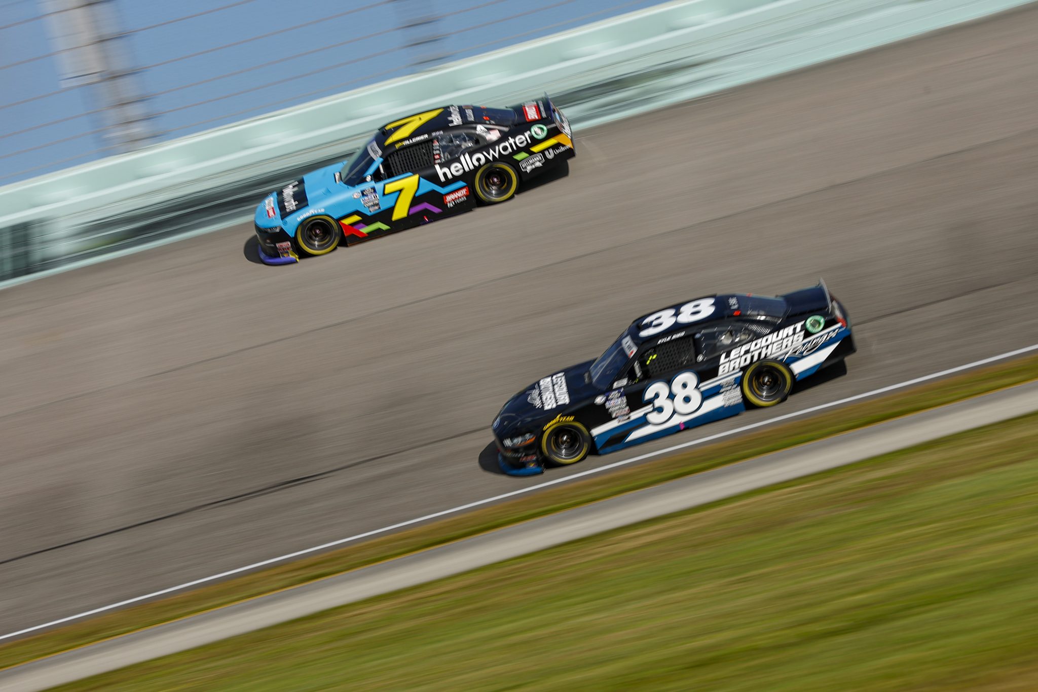 HOMESTEAD, FLORIDA - OCTOBER 21: Justin Allgaier, driver of the #7 hellowater Chevrolet, and Kyle Sieg, driver of the #38 Lefcourt Brothers Ford, race during the NASCAR Xfinity Series Contender Boats 300 at Homestead-Miami Speedway on October 21, 2023 in Homestead, Florida. (Photo by Sean Gardner/Getty Images) | Getty Images