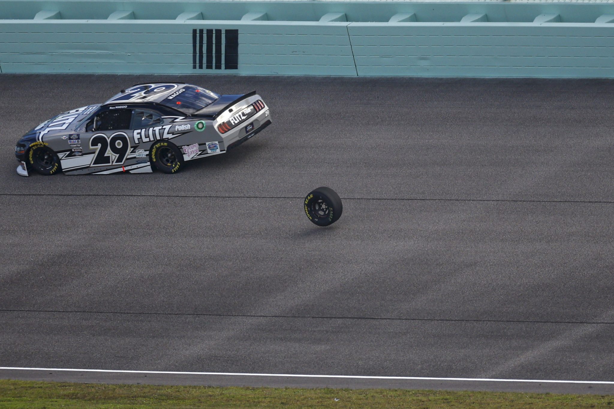 HOMESTEAD, FLORIDA - OCTOBER 21: Mason Maggio, driver of the #29 Flitz Polish Ford, avoids a loose tire after an on-track incident during the NASCAR Xfinity Series Contender Boats 300 at Homestead-Miami Speedway on October 21, 2023 in Homestead, Florida. (Photo by James Gilbert/Getty Images) | Getty Images