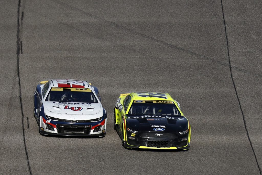 HOMESTEAD, FLORIDA - OCTOBER 22: Ryan Blaney, driver of the #12 Menards/Duracell Ford, and William Byron, driver of the #24 Liberty University Chevrolet, race during the NASCAR Cup Series 4EVER 400 Presented by Mobil 1 at Homestead-Miami Speedway on October 22, 2023 in Homestead, Florida. (Photo by Sean Gardner/Getty Images) | Getty Images