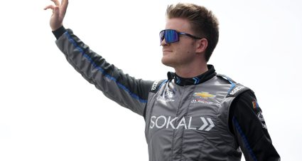 DOVER, DELAWARE - APRIL 29: Stefan Parsons, driver of the #07 Ollie's Chevrolet, waves to fans as he walks onstage during driver intros prior to the NASCAR Xfinity Series A-GAME 200 at Dover International Speedway on April 29, 2023 in Dover, Delaware. (Photo by James Gilbert/Getty Images) | Getty Images