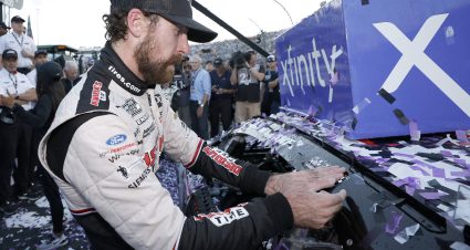 MARTINSVILLE, VIRGINIA - OCTOBER 29: Ryan Blaney, driver of the #12 Discount Tire Ford, places the winner sticker on his car in victory lane after winning the NASCAR Cup Series Xfinity 500 at Martinsville Speedway on October 29, 2023 in Martinsville, Virginia. (Photo by Chris Graythen/Getty Images) | Getty Images
