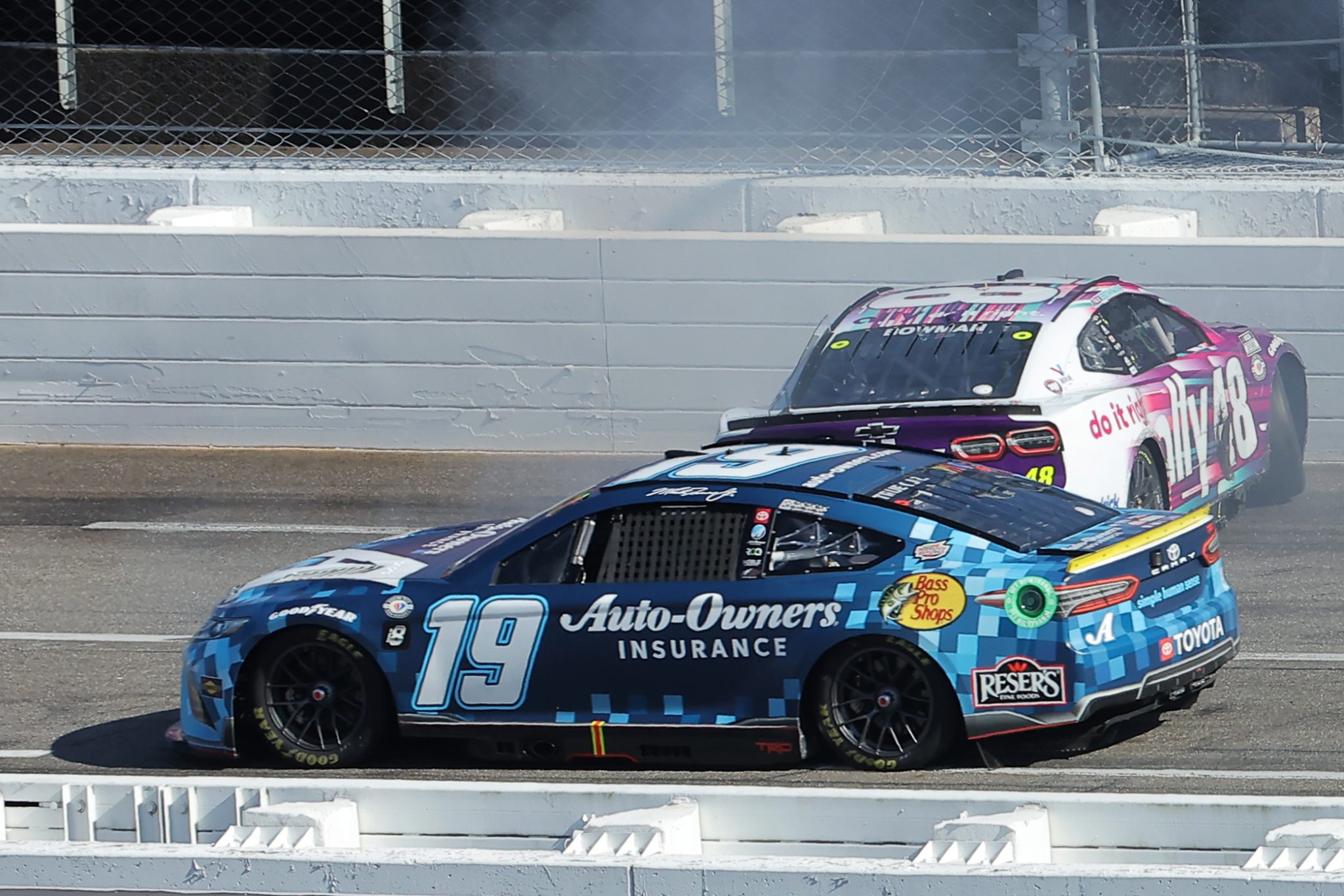 MARTINSVILLE, VIRGINIA - OCTOBER 29: Martin Truex Jr., driver of the #19 Auto-Owners Insurance Toyota, avoids Alex Bowman, driver of the #48 Ally Chevrolet, spinning after an on-track incident during the NASCAR Cup Series Xfinity 500 at Martinsville Speedway on October 29, 2023 in Martinsville, Virginia. (Photo by Jonathan Bachman/Getty Images) | Getty Images