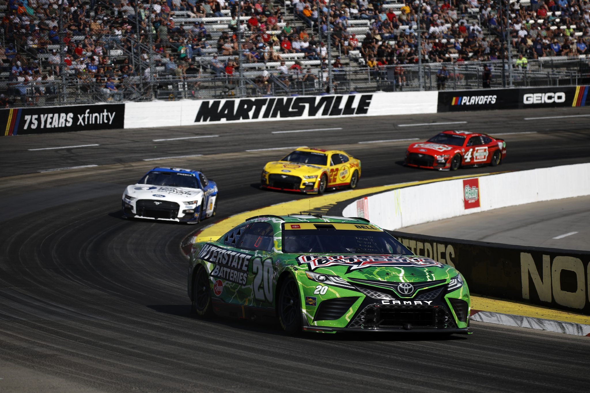 MARTINSVILLE, VIRGINIA - OCTOBER 29: Christopher Bell, driver of the #20 Interstate Batteries Toyota, Ryan Preece, driver of the #41 United Rentals Ford, Joey Logano, driver of the #22 Shell Pennzoil Ford, and Kevin Harvick, driver of the #4 Hunt Brothers Pizza Ford, race during the NASCAR Cup Series Xfinity 500 at Martinsville Speedway on October 29, 2023 in Martinsville, Virginia. (Photo by Chris Graythen/Getty Images) | Getty Images