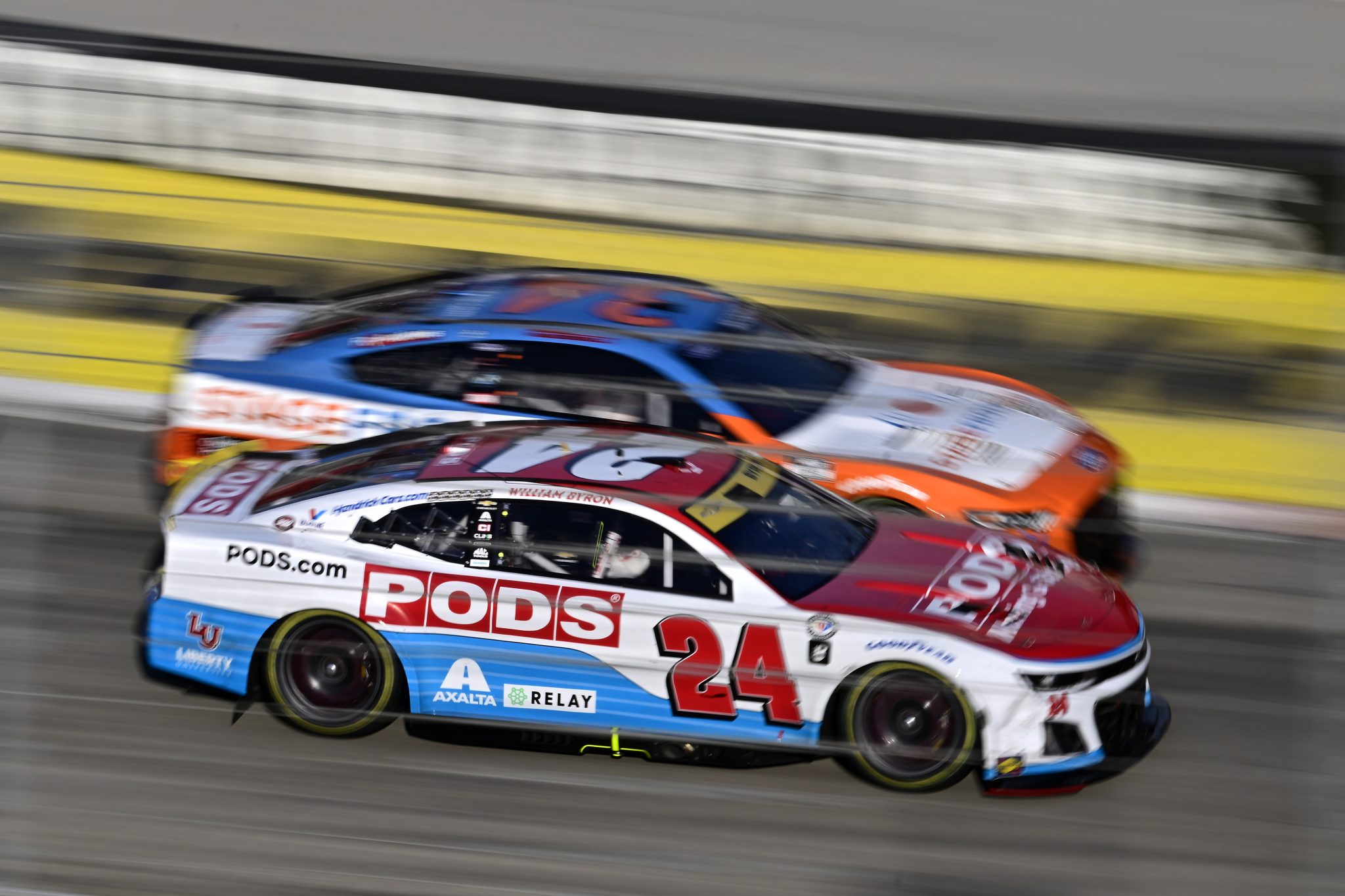 MARTINSVILLE, VIRGINIA - OCTOBER 29: William Byron, driver of the #24 PODS Chevrolet, and Michael McDowell, driver of the #34 StageFront.VIP Ford, race during the NASCAR Cup Series Xfinity 500 at Martinsville Speedway on October 29, 2023 in Martinsville, Virginia. (Photo by Logan Whitton/Getty Images) | Getty Images