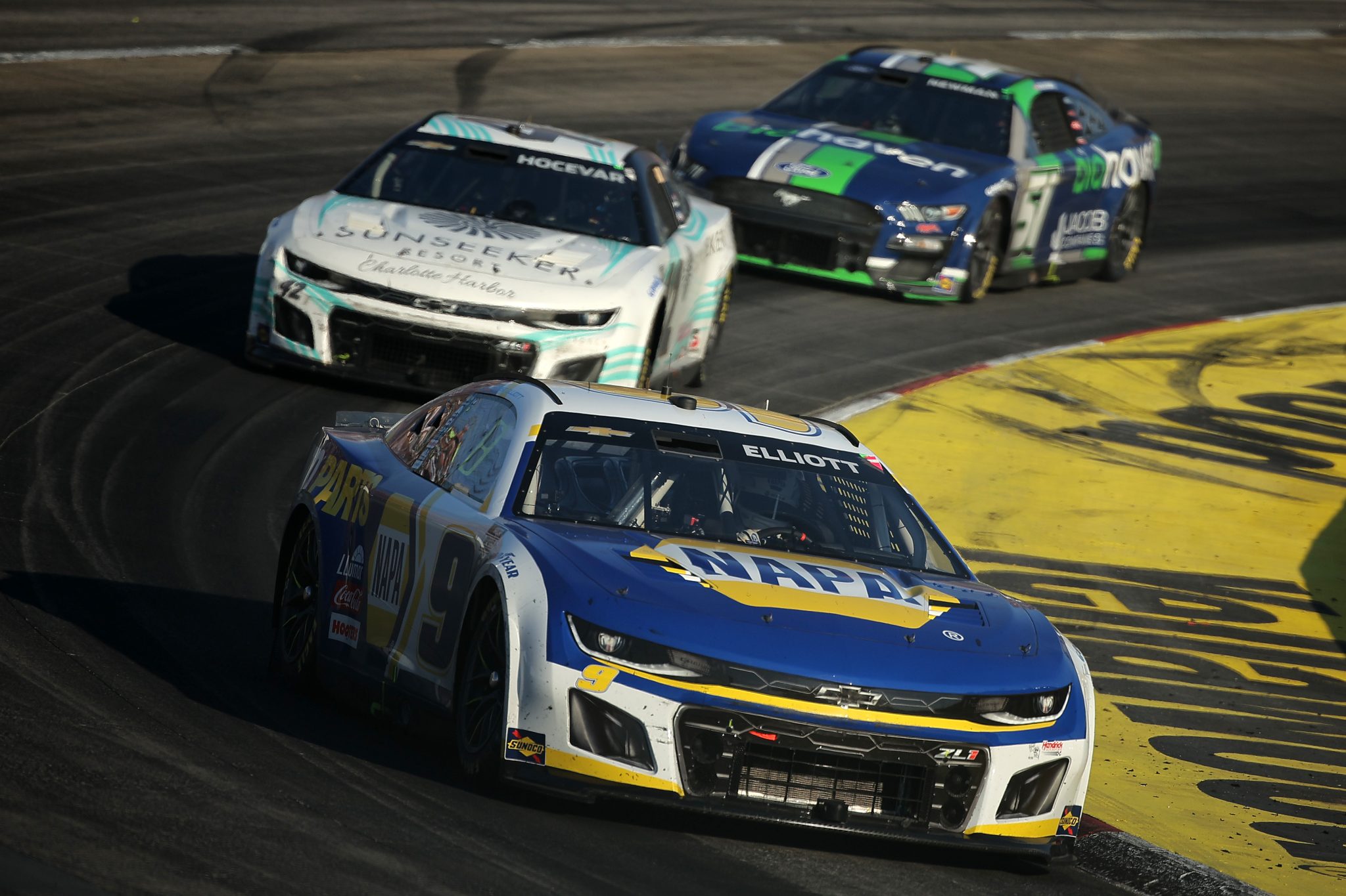 MARTINSVILLE, VIRGINIA - OCTOBER 29: Chase Elliott, driver of the #9 NAPA Auto Parts Chevrolet, Carson Hocevar, driver of the #42 Sunseeker Resorts Chevrolet, and Ryan Newman, driver of the #51 Biohaven/Jacob Co Ford, race during the NASCAR Cup Series Xfinity 500 at Martinsville Speedway on October 29, 2023 in Martinsville, Virginia. (Photo by Jonathan Bachman/Getty Images) | Getty Images