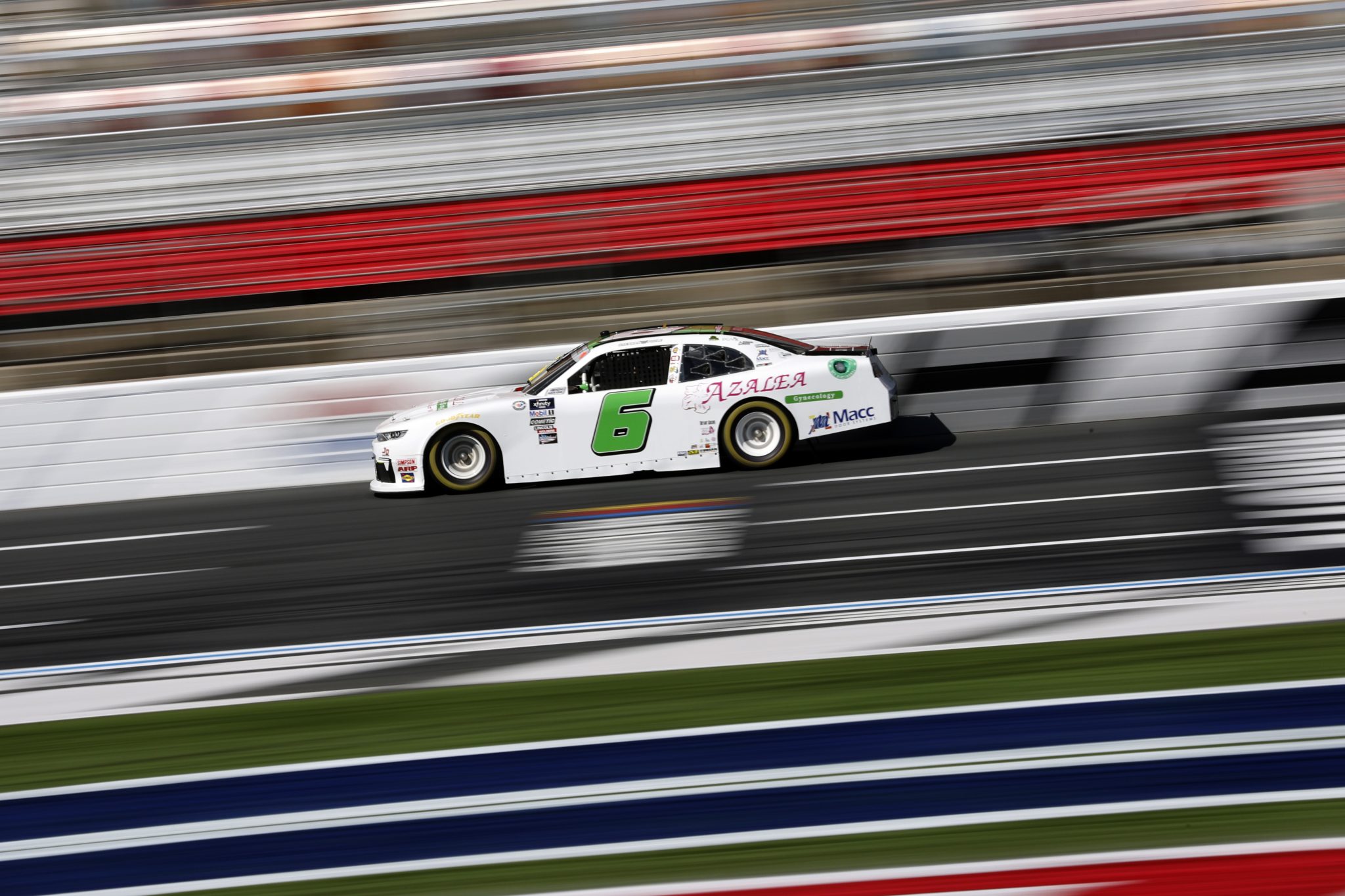 CONCORD, NORTH CAROLINA - OCTOBER 07: Brennan Poole, driver of the #6 Azalea Gynecology Chevrolet, drives during qualifying for the NASCAR Xfinity Series Drive for the Cure 250 presented by BCBS at Charlotte Motor Speedway on October 07, 2023 in Concord, North Carolina. (Photo by James Gilbert/Getty Images) | Getty Images