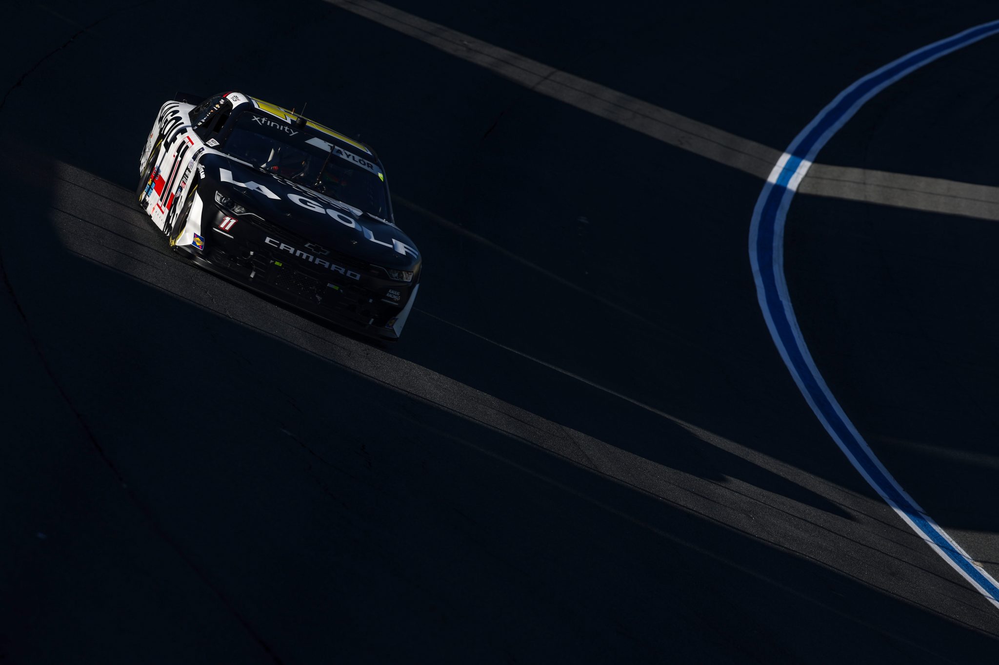 CONCORD, NORTH CAROLINA - OCTOBER 07: Jordan Taylor, driver of the #11 LA Golf Chevrolet, drives during the NASCAR Xfinity Series Drive for the Cure 250 presented by BCBS at Charlotte Motor Speedway on October 07, 2023 in Concord, North Carolina. (Photo by Jared C. Tilton/Getty Images) | Getty Images