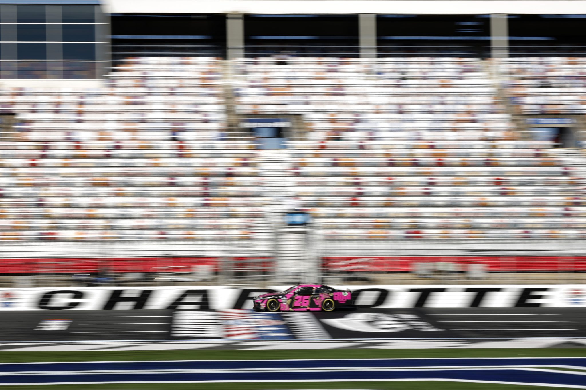 CONCORD, NORTH CAROLINA - OCTOBER 07: Kaz Grala, driver of the #26 CRUSH Strawberry Lemonade Toyota, drives during practice for the NASCAR Xfinity Series Drive for the Cure 250 presented by BCBS at Charlotte Motor Speedway on October 07, 2023 in Concord, North Carolina. (Photo by James Gilbert/Getty Images) | Getty Images