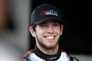 INDIANAPOLIS, INDIANA - AUGUST 12: Chandler Smith, driver of the #16 Quick Tie Products Inc. Chevrolet, waits backstage during pre-race ceremonies prior to the NASCAR Xfinity Series Pennzoil 150 at the Brickyard at Indianapolis Motor Speedway on August 12, 2023 in Indianapolis, Indiana. (Photo by Sean Gardner/Getty Images) | Getty Images