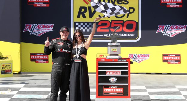 TALLADEGA, ALABAMA - SEPTEMBER 30: Brett Moffitt, driver of the #34 Fr8Auctions Ford, celebrates with Stephanie Campo in victory lane after winning  the NASCAR Craftsman Truck Series Love's RV Stop 250 at Talladega Superspeedway on September 30, 2023 in Talladega, Alabama. (Photo by Meg Oliphant/Getty Images) | Getty Images