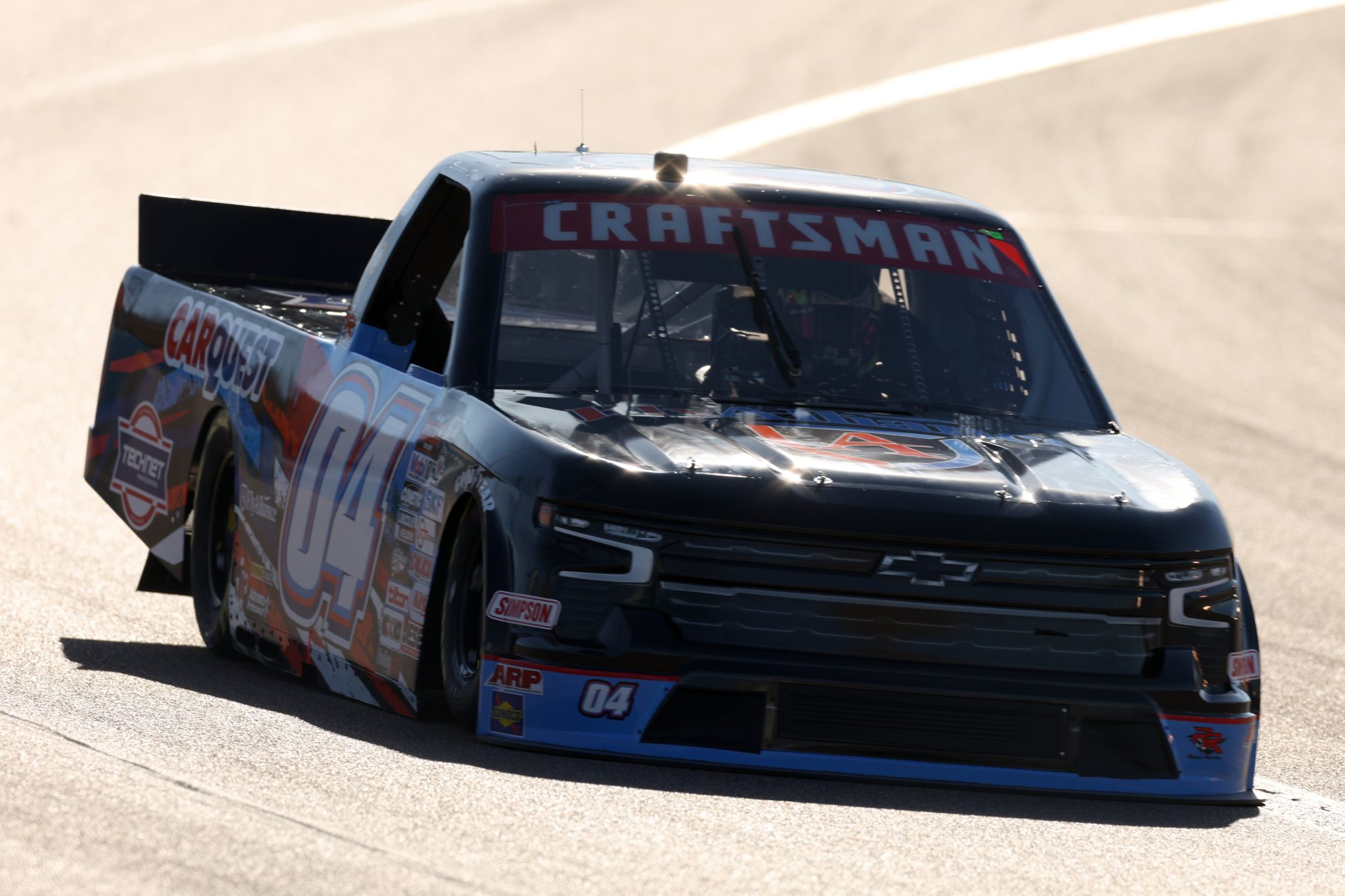 AVONDALE, ARIZONA - NOVEMBER 03: Spencer Davis, driver of the #04 Fly Alliance/CarQuest Ford, drives during qualifying for the NASCAR Craftsman Truck Series Craftsman 150 at Phoenix Raceway on November 03, 2023 in Avondale, Arizona. (Photo by Christian Petersen/Getty Images) | Getty Images