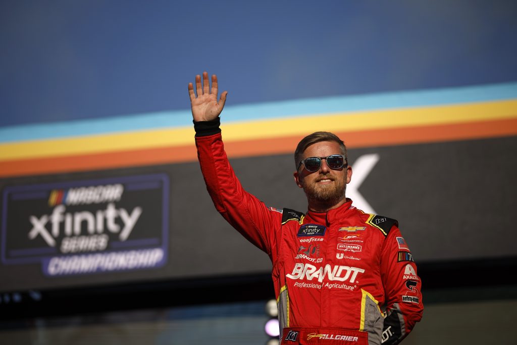 AVONDALE, ARIZONA - NOVEMBER 04: Justin Allgaier, driver of the #7 BRANDT Chevrolet, waves to fans as he walks onstage during driver intros prior to the NASCAR Xfinity Series Championship at Phoenix Raceway on November 04, 2023 in Avondale, Arizona. (Photo by James Gilbert/Getty Images) | Getty Images