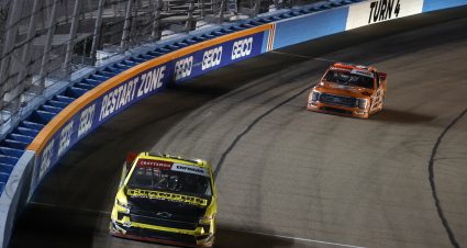 AVONDALE, ARIZONA - NOVEMBER 03: Grant Enfinger, driver of the #23 Champion Power Equipment Chevrolet, and Ben Rhodes, driver of the #99 Kubota Ford, race during the NASCAR Craftsman Truck Series Craftsman 150 at Phoenix Raceway on November 03, 2023 in Avondale, Arizona. (Photo by Sean Gardner/Getty Images) | Getty Images