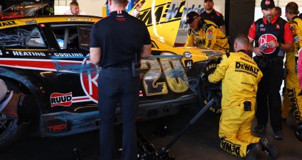 AVONDALE, ARIZONA - NOVEMBER 05: Crew members work on the #20 Rheem/DEWALT Toyota, driven by Christopher Bell in the garage area as NASCAR Officials looks on during the NASCAR Cup Series Championship at Phoenix Raceway on November 05, 2023 in Avondale, Arizona. (Photo by Jared C. Tilton/Getty Images) | Getty Images