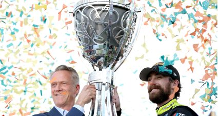 AVONDALE, ARIZONA - NOVEMBER 05: NASCAR President Steve Phelps  presents the Bill France NASCAR Cup Series Championship trophy to Ryan Blaney, driver of the #12 Menards/Dutch Boy Ford, in victory lane after winning the 2023 NASCAR Cup Series Championship, finishing first of the Championship 4 drivers in the NASCAR Cup Series Championship race at Phoenix Raceway on November 05, 2023 in Avondale, Arizona. (Photo by Jared C. Tilton/Getty Images) | Getty Images